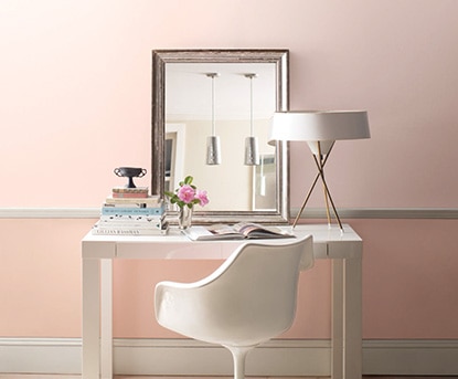 White desk along pink accent wall White desk along pink accent wall