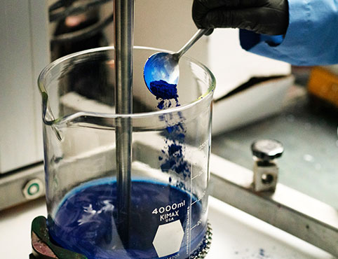 A chemist in the Benjamin Moore R&D lab works on the paint formulation for AURA Interior paint. A chemist in the Benjamin Moore R&D lab works on the paint formulation for AURA Interior paint.