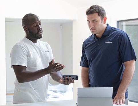Painting contractors reviewing an estimate.